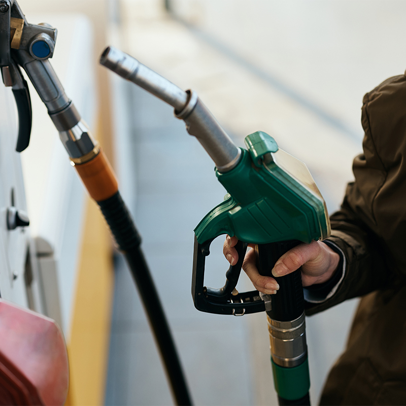 a hand holding a fuel pump