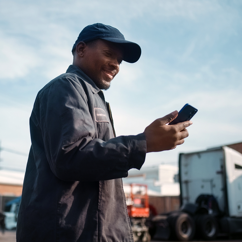 a trucker using a smartphone
