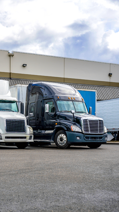 semi trucks at a loading dock