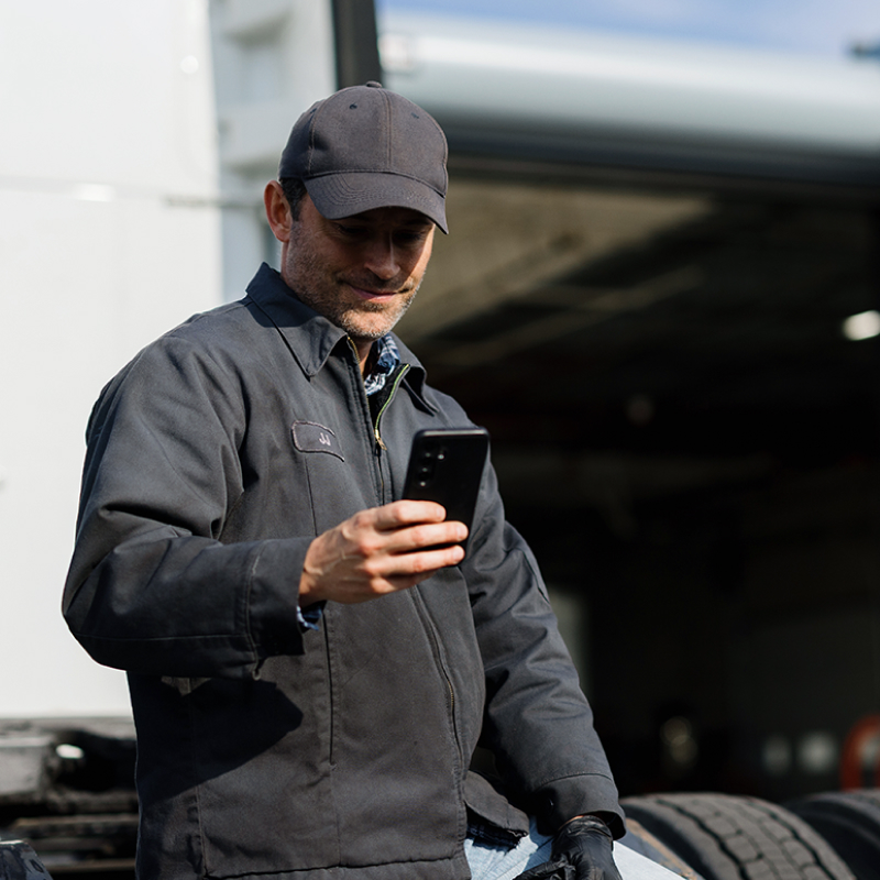 a trucker using a smartphone