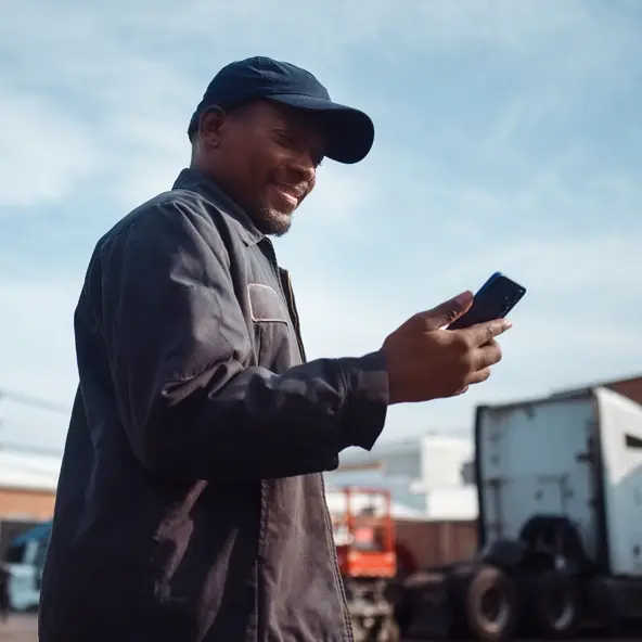trucker looking at phone
