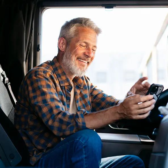 trucker looking at phone