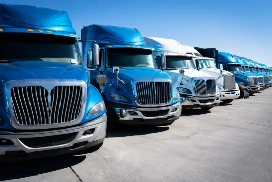 Row of parked trucks. 