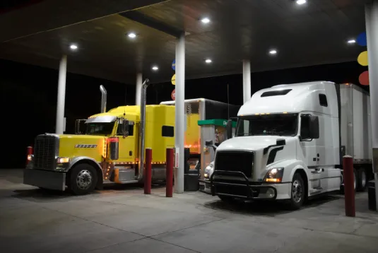 Trucks at a fuel station. 
