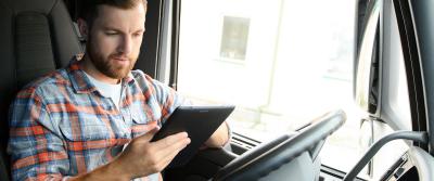 Truck driver parked using iPad