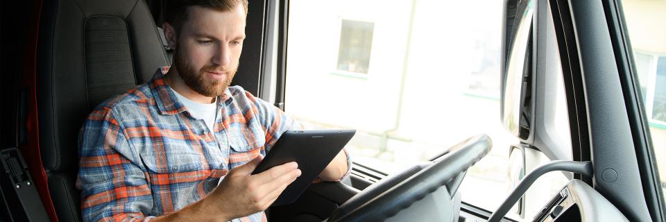 Truck driver parked using iPad