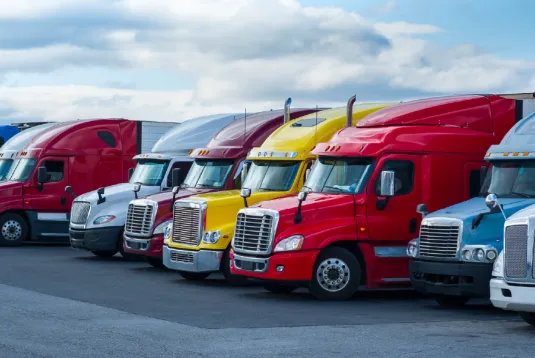 Trucks parked in a line.