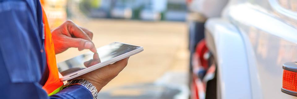 driver scrolling a tablet