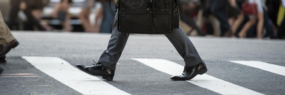 person walking on crosswalk bg