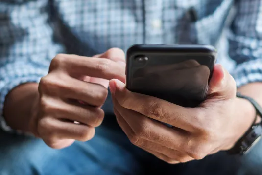 Person scrolling on a phone.